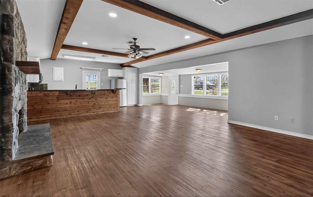 535 Riata Road Bullard, TX 75757 - Photo 31 of 40 a view of an empty room with wooden floor and a window