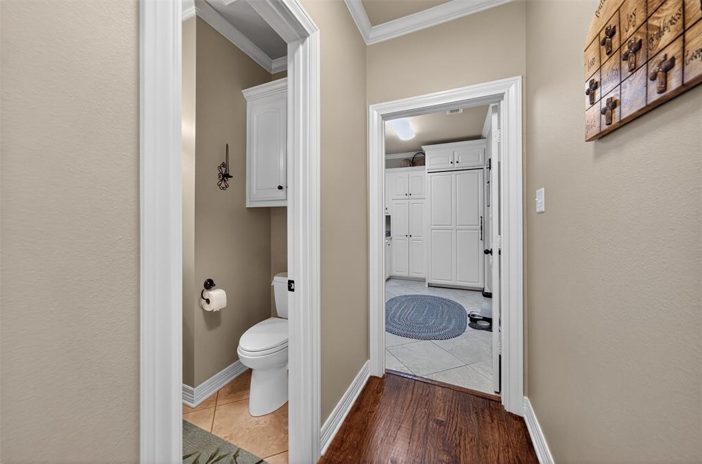 535 Riata Road Bullard, TX 75757 - Photo 35 of 40 a bathroom with a granite countertop toilet a sink and shower