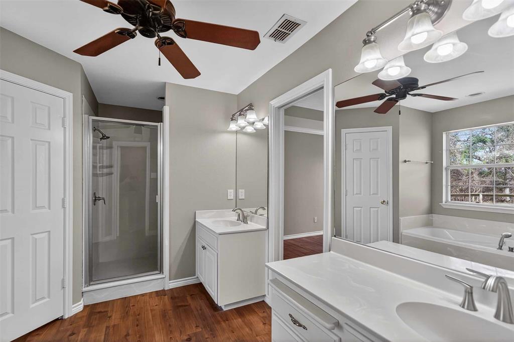 535 Riata Road Bullard, TX 75757 - Photo 37 of 40 a bathroom with a sink a light fixture and a mirror