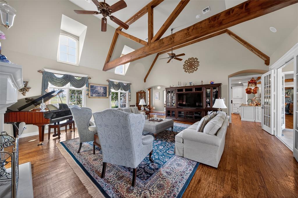 535 Riata Road Bullard, TX 75757 - Photo 6 of 40 a living room with furniture and a flat screen tv