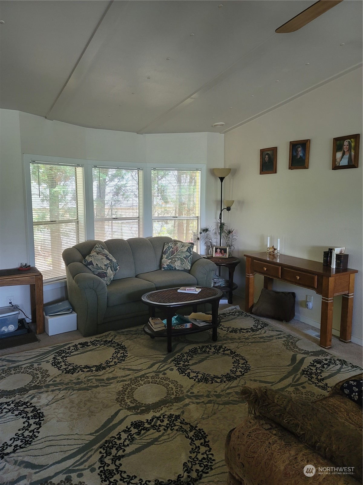 375 Union Avenue Southeast, Unit 36 Renton, WA 98059 - Photo 11 of 25 a living room with furniture a rug and a window