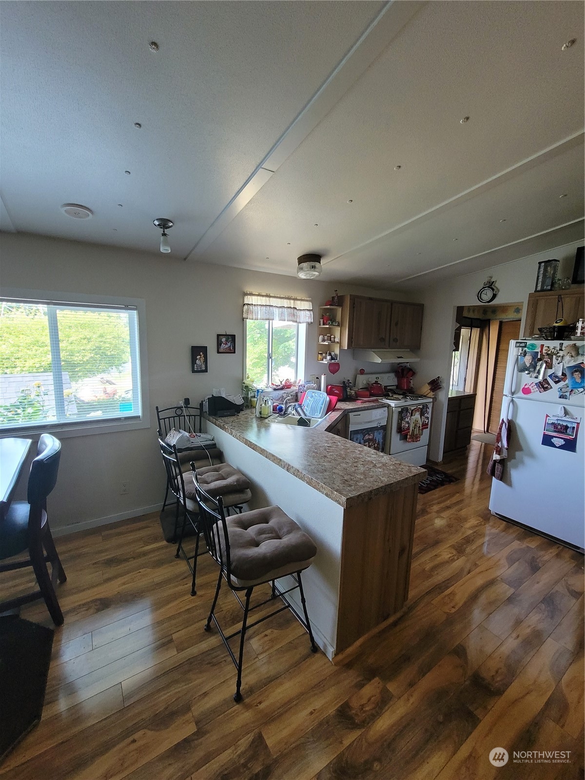 375 Union Avenue Southeast, Unit 36 Renton, WA 98059 - Photo 13 of 25 a living room with furniture a piano and a flat screen tv
