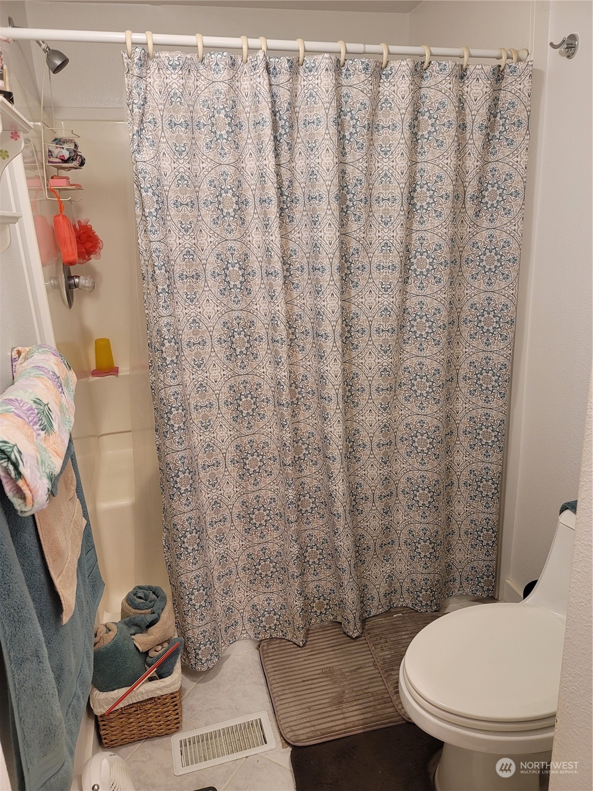 375 Union Avenue Southeast, Unit 36 Renton, WA 98059 - Photo 15 of 25 a bathroom with a toilet and a shower curtain