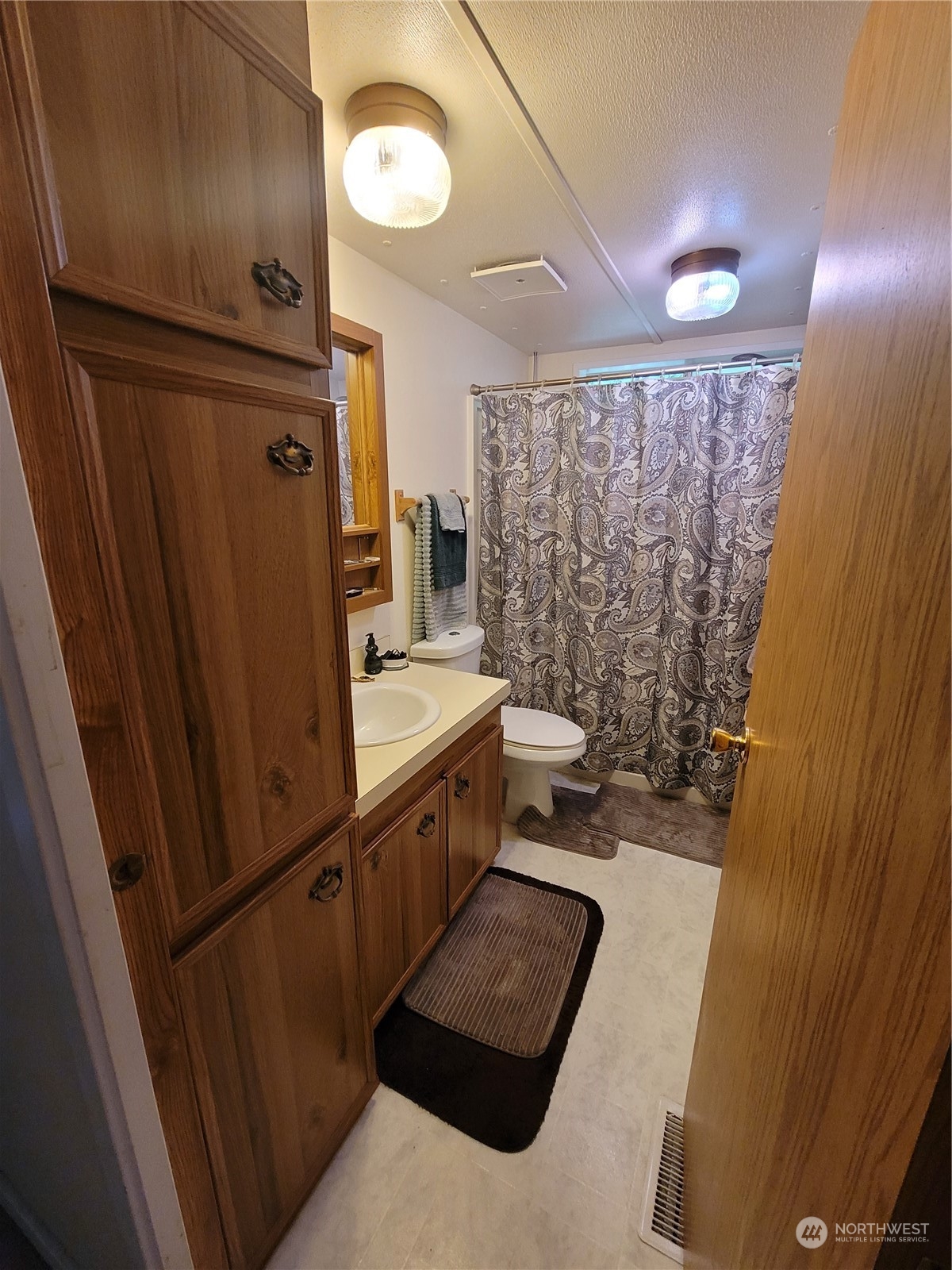 375 Union Avenue Southeast, Unit 36 Renton, WA 98059 - Photo 19 of 25 a bathroom with sink shower and mirror