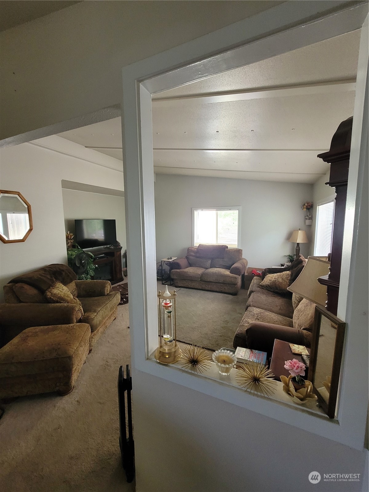 375 Union Avenue Southeast, Unit 36 Renton, WA 98059 - Photo 5 of 25 a living room with furniture and a flat screen tv