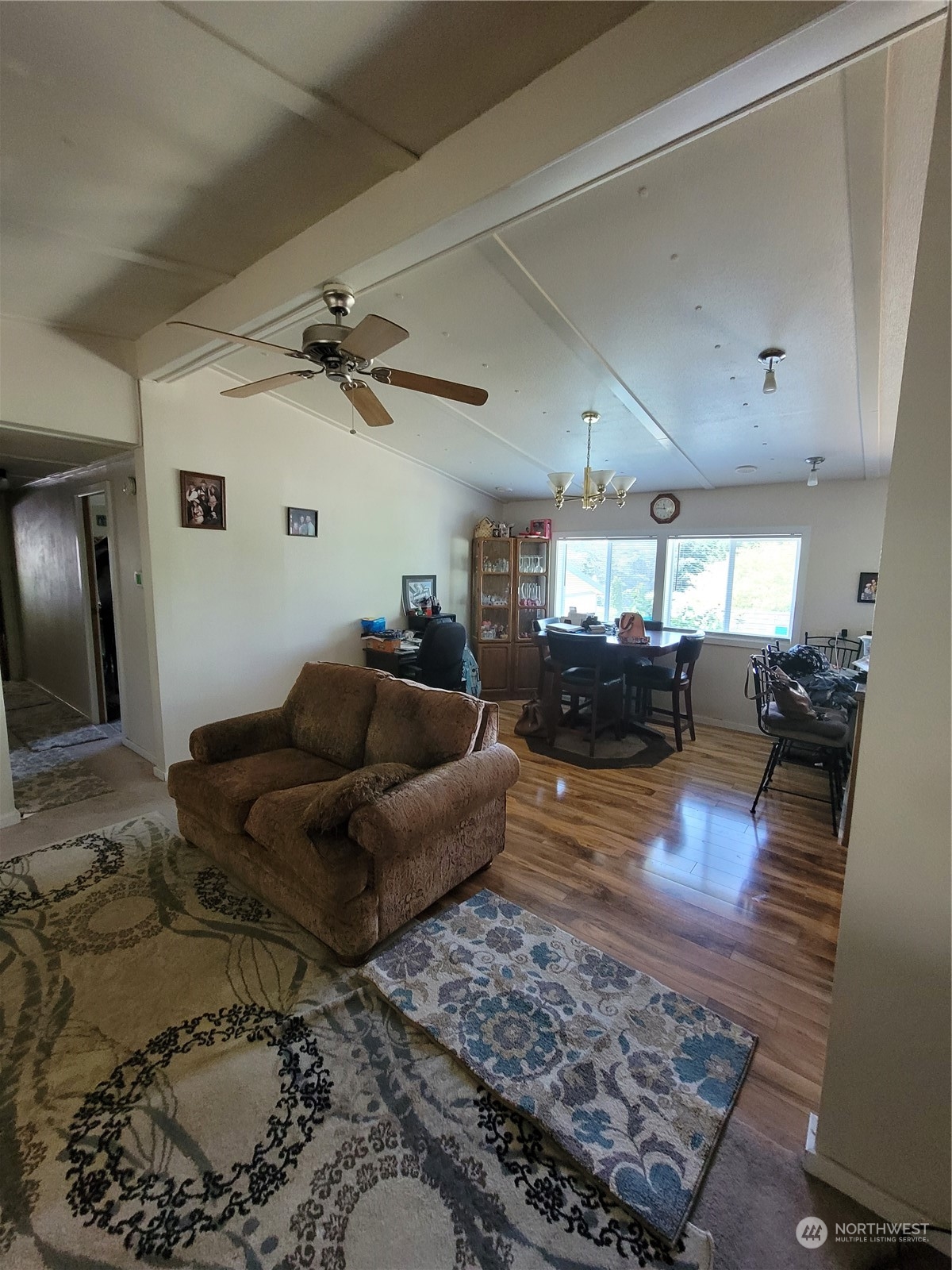 375 Union Avenue Southeast, Unit 36 Renton, WA 98059 - Photo 8 of 25 a living room with furniture and a wooden floor