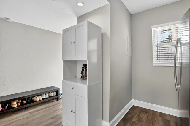 a kitchen with a refrigerator and a stove