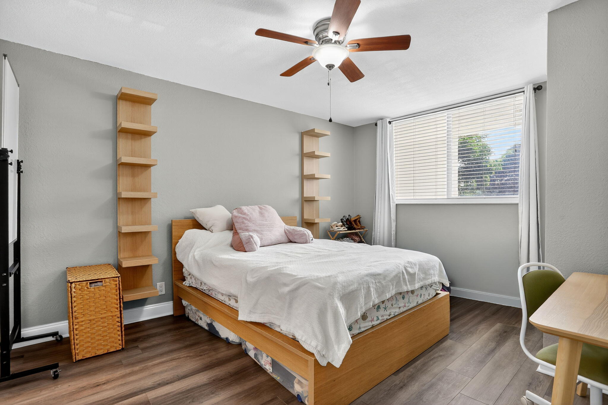 9450 Poinciana Place, Unit 203 Davie, FL 33324 - Photo 15 of 32 a bedroom with a bed and a chandelier