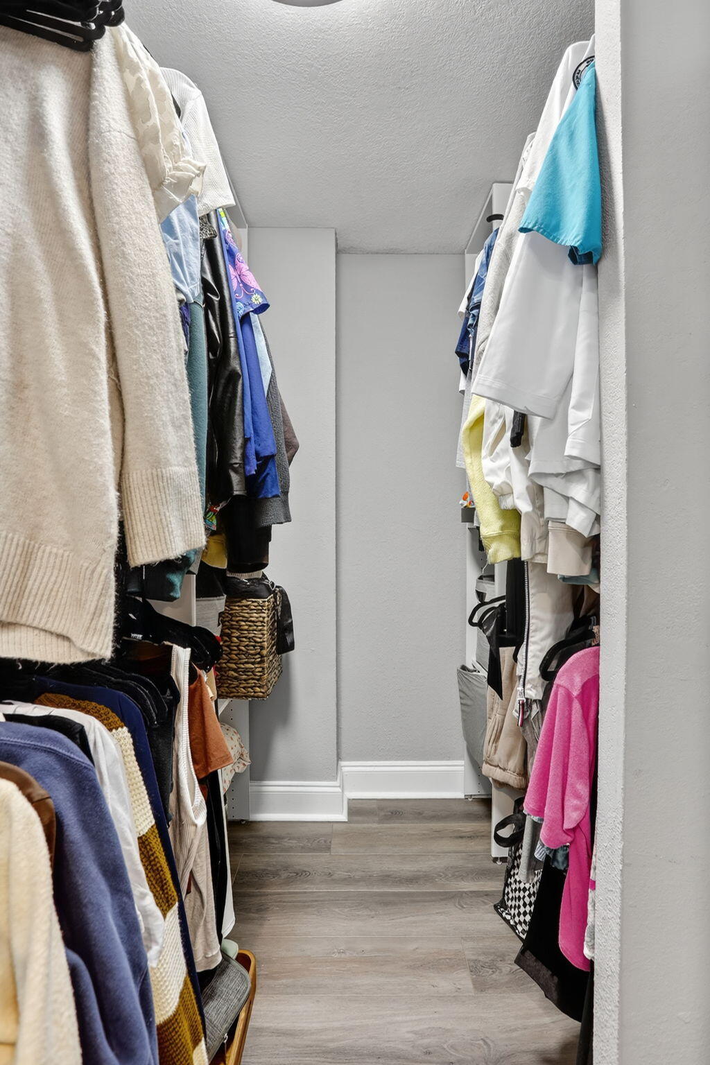9450 Poinciana Place, Unit 203 Davie, FL 33324 - Photo 19 of 32 a view of walk in closet with clothes and shoes