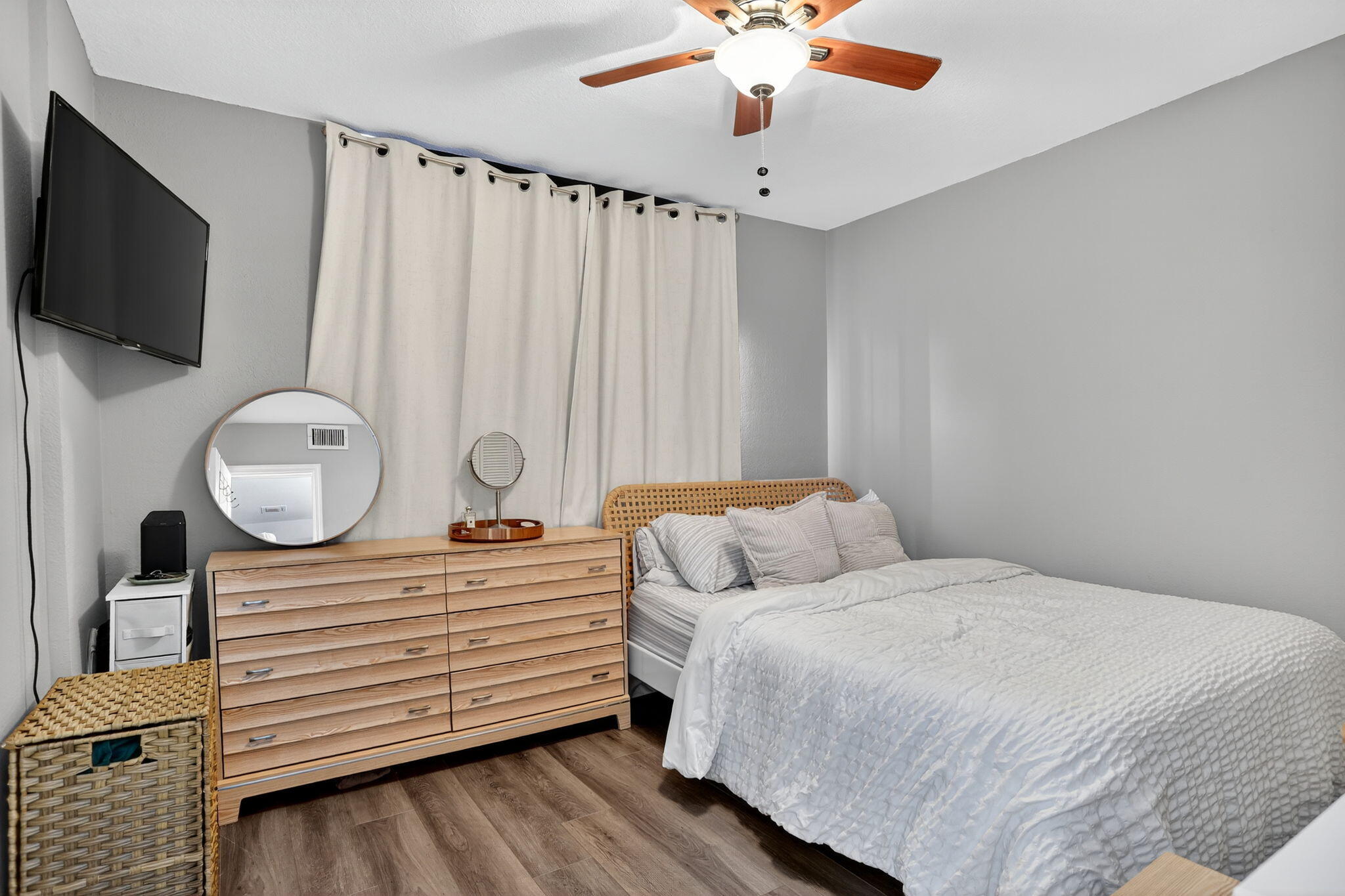 9450 Poinciana Place, Unit 203 Davie, FL 33324 - Photo 20 of 32 a bedroom with a bed a flat screen tv and chandelier