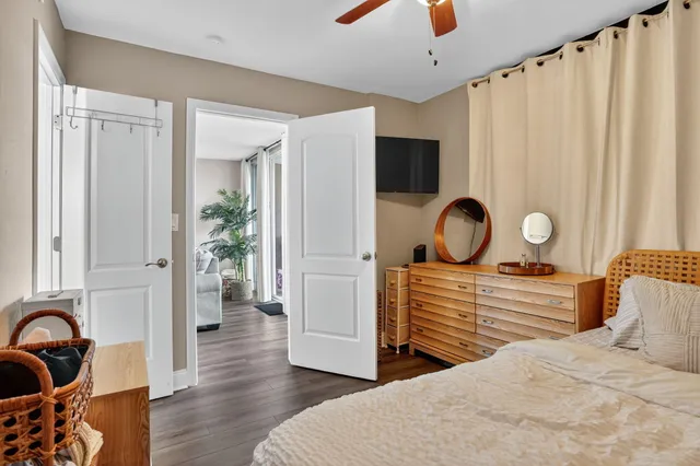 a bedroom with a bed and a dresser