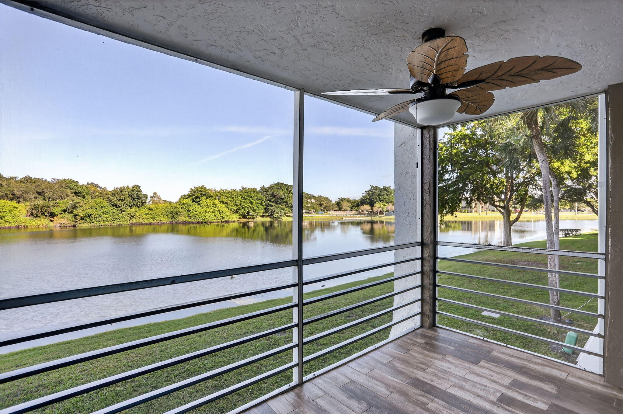 9450 Poinciana Place, Unit 203 Davie, FL 33324 - Photo 22 of 32 a view of a balcony with lake view