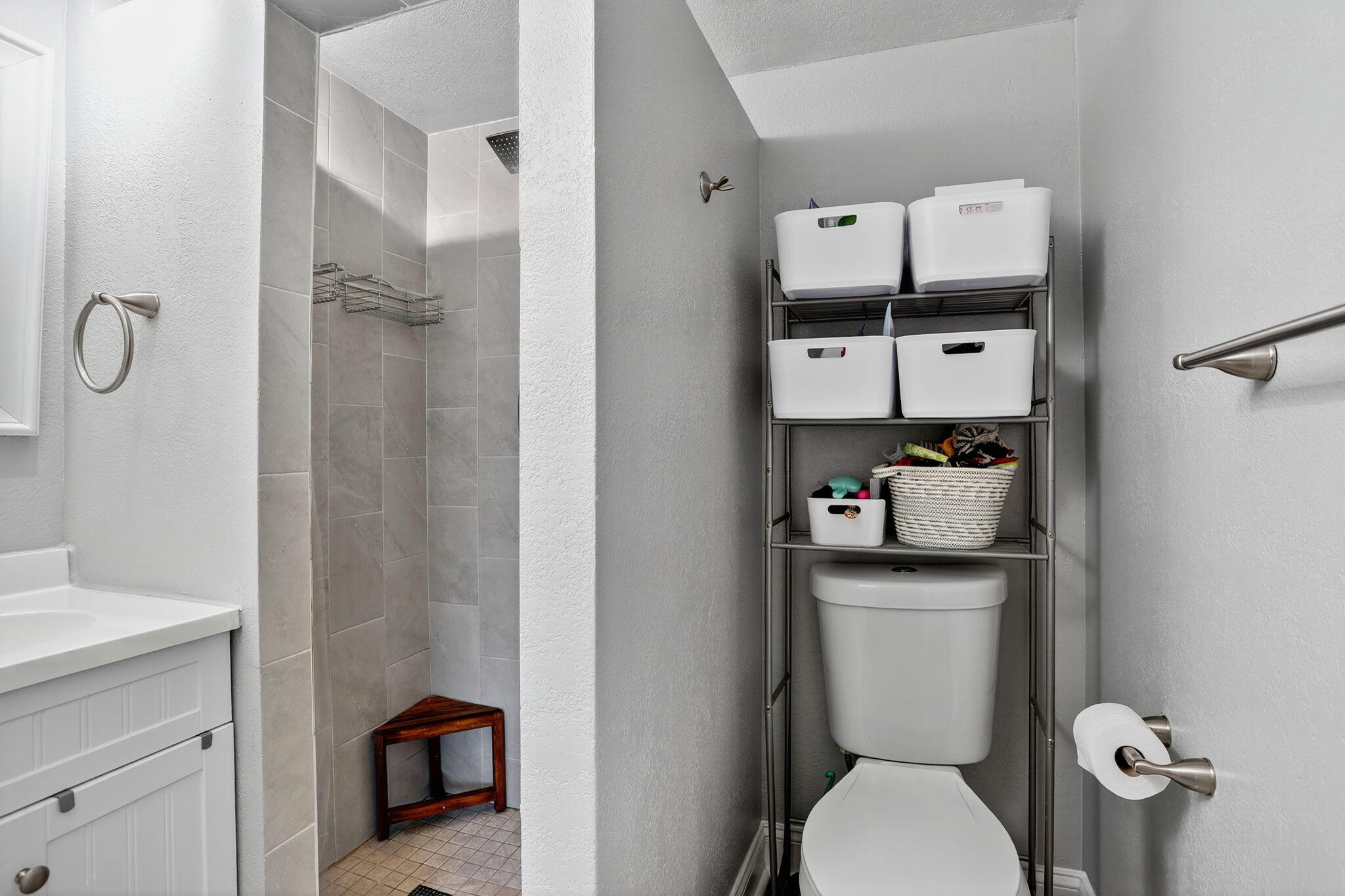 9450 Poinciana Place, Unit 203 Davie, FL 33324 - Photo 24 of 32 a white toilet sitting next to a bathroom sink