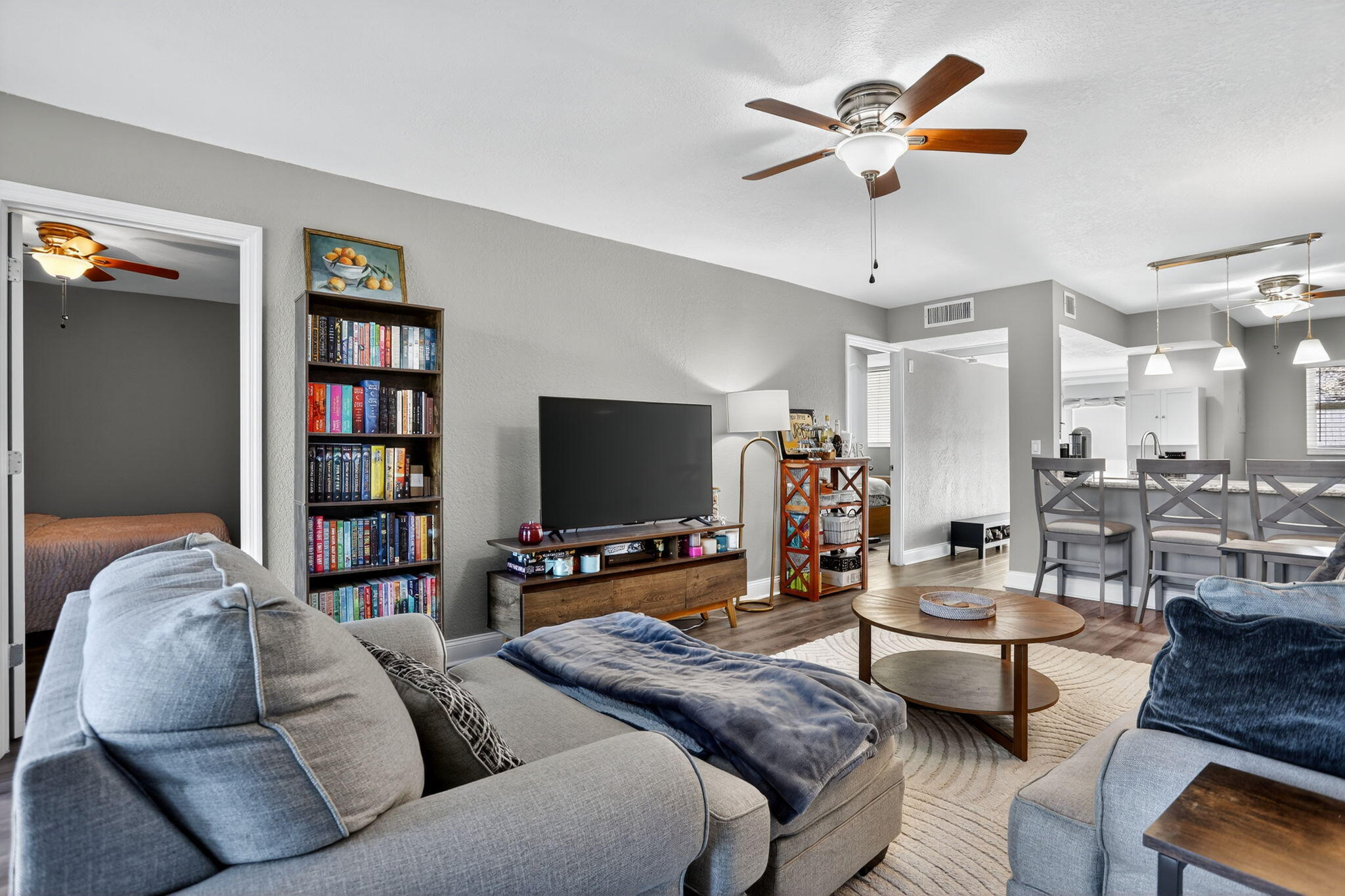 9450 Poinciana Place, Unit 203 Davie, FL 33324 - Photo 5 of 32 a living room with furniture and a flat screen tv