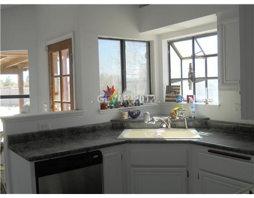 3601 North Solitude Road Las Vegas, NV 89108 - Photo 3 of 18 Kitchen. A great kitchen looking into the back yard. This is a great place to entertain. Imagine your herbs growing with the windows.