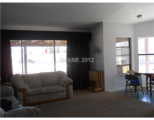 3601 North Solitude Road Las Vegas, NV 89108 - Photo 6 of 18 Living Room. Another view of the living room. Lots of windows with natural light and can see into the back yard