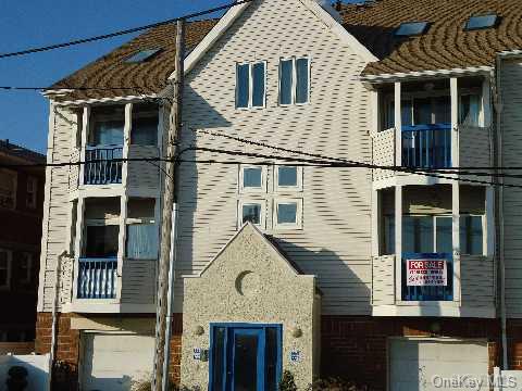 773 Shore Road Long Beach, NY 11561 - Photo 1 of 1 a view of a house with a window and balcony