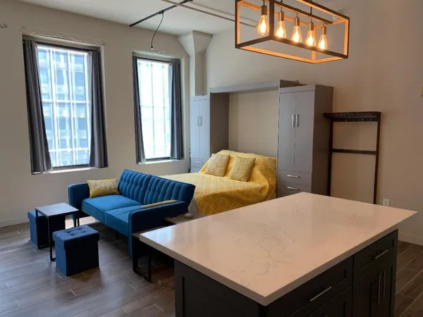 a bedroom with two beds and a window