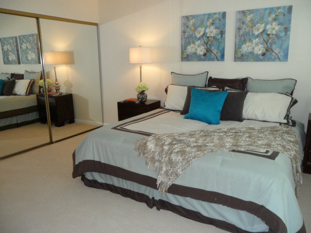 5233 Country Forge Lane San Jose, CA 95136 - Photo 14 of 25 a bedroom with a bed and lamp