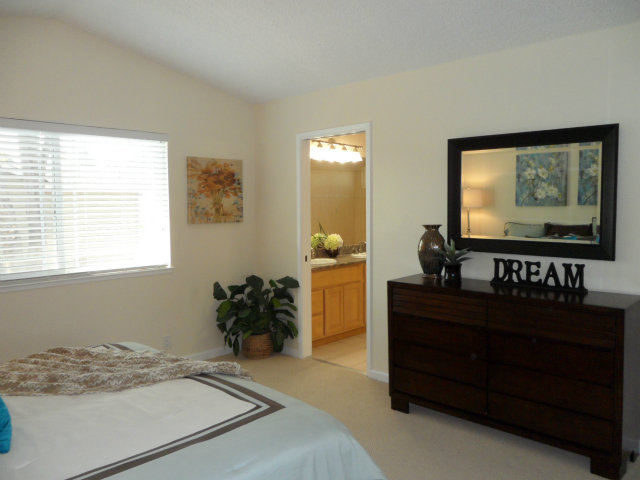 5233 Country Forge Lane San Jose, CA 95136 - Photo 15 of 25 a bedroom with a bed and a dresser