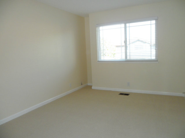 5233 Country Forge Lane San Jose, CA 95136 - Photo 18 of 25 an empty room with a window