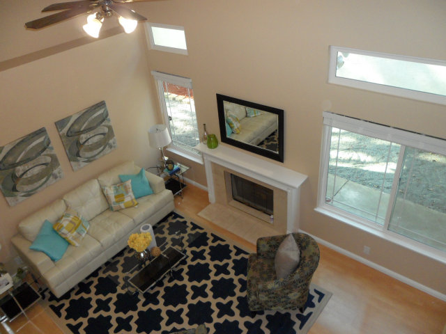5233 Country Forge Lane San Jose, CA 95136 - Photo 5 of 25 a living room with furniture a flat screen tv and a large window