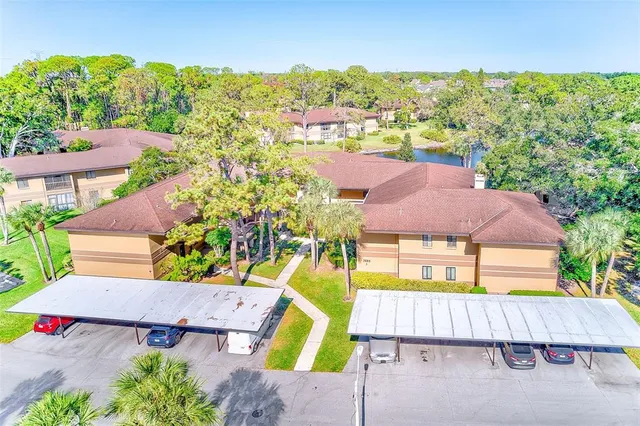 an aerial view of residential house with outdoor space and parking