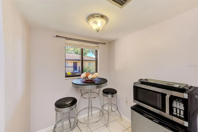 a view of an chairs and table in a room