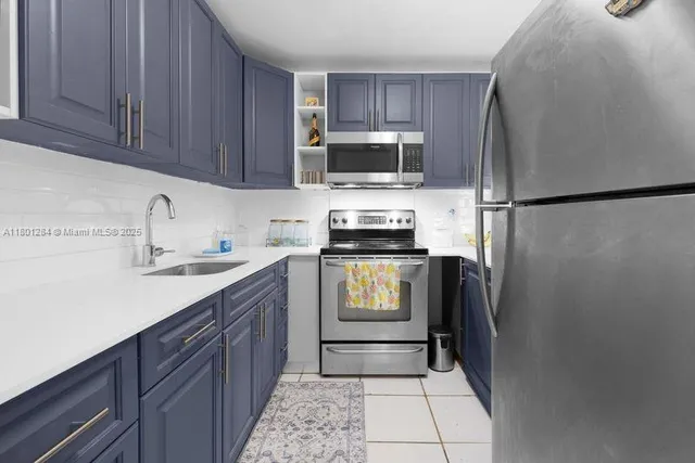 a kitchen with a refrigerator sink and microwave