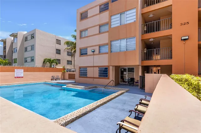 a view of an buildings with swimming pool