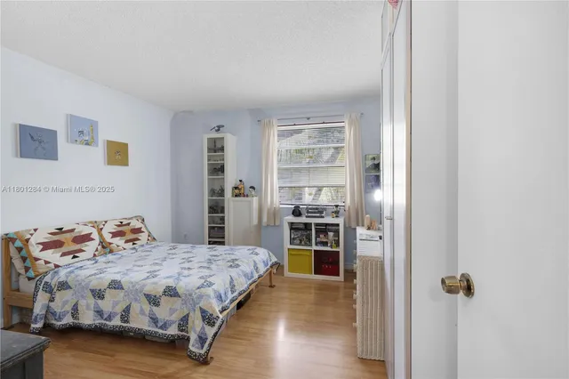 a bedroom with a bed and a cabinets