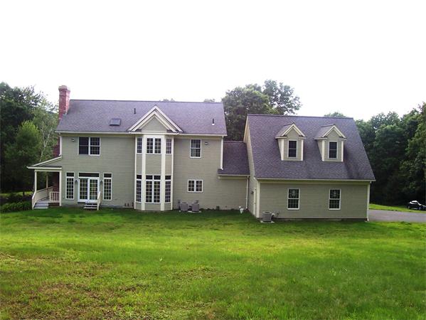 169 Scantic Road Hampden, MA 01036 - Photo 3 of 22 a view of a house with a garden and deck