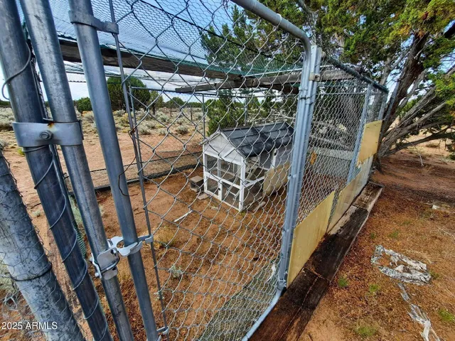 a dining room with furniture window and wooden floor