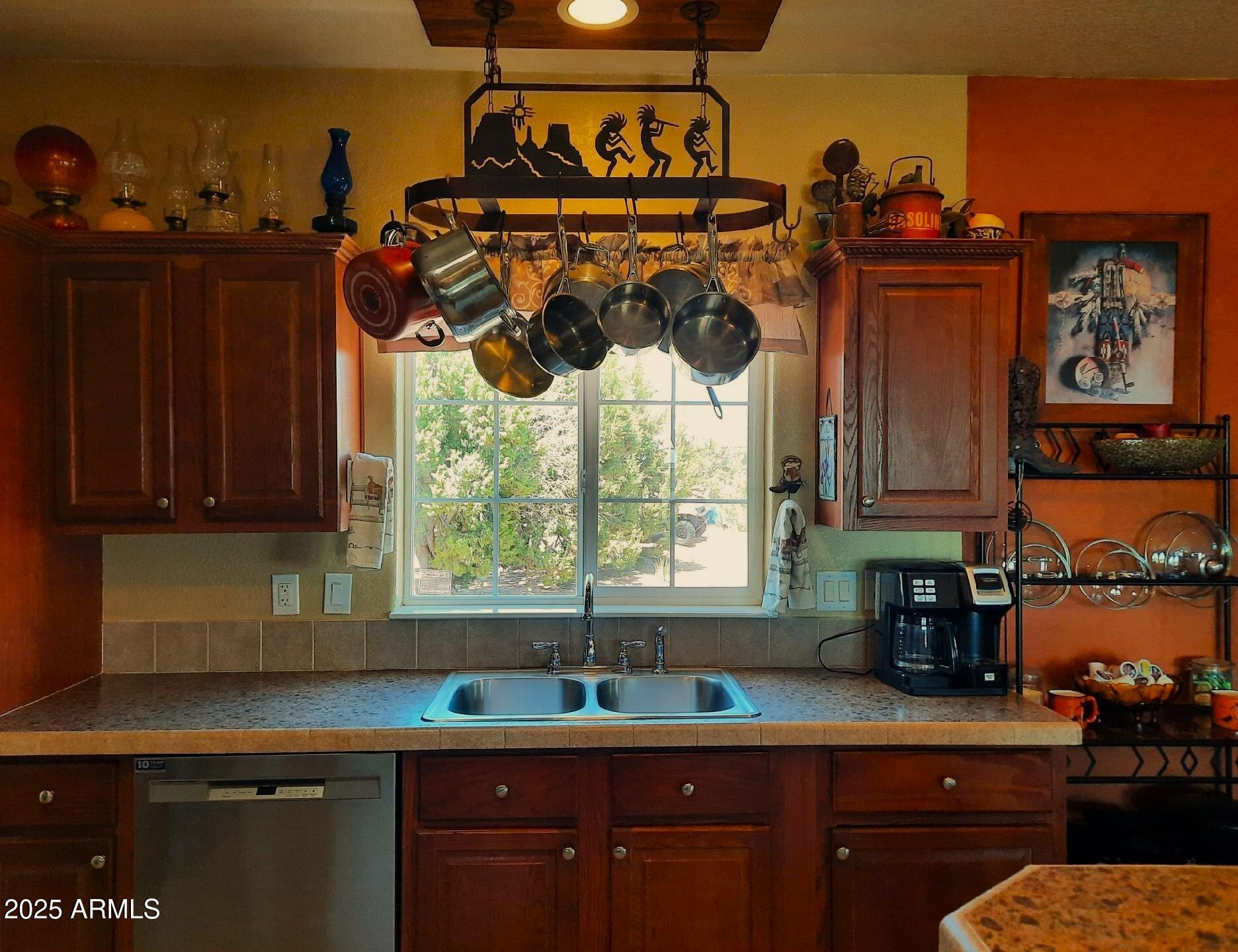 74 N7121 Red Sky Ranch St. Johns, AZ 85936 - Photo 27 of 65 a kitchen with a sink and cabinets