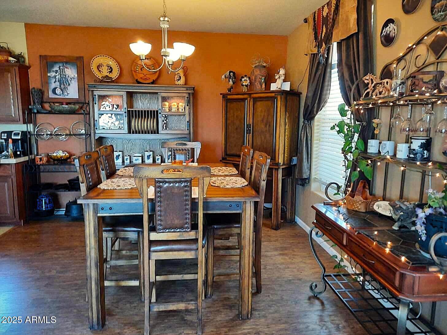 74 N7121 Red Sky Ranch St. Johns, AZ 85936 - Photo 28 of 65 a view of a dining room with furniture and chandelier