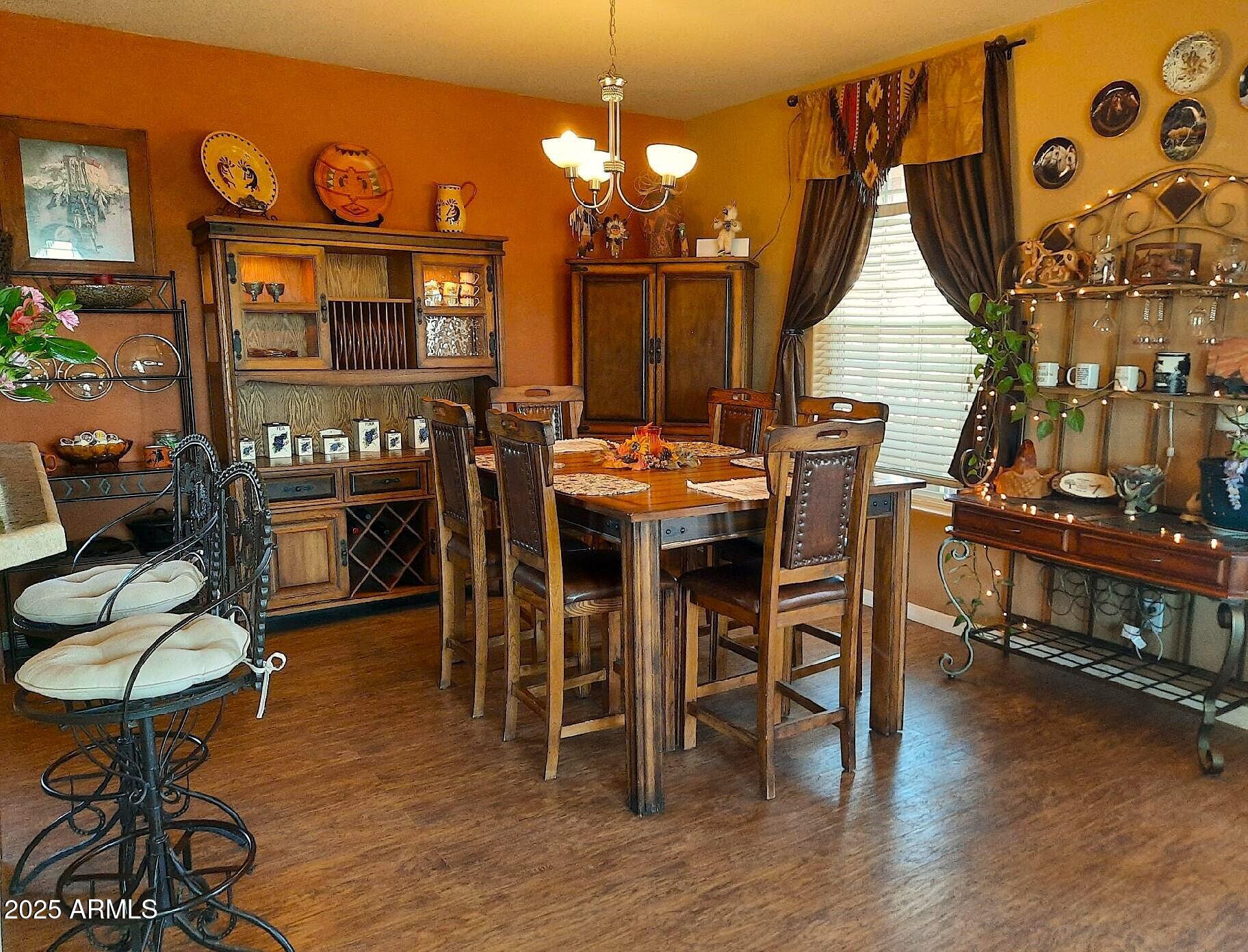 74 N7121 Red Sky Ranch St. Johns, AZ 85936 - Photo 30 of 65 a dining room with furniture window and wooden floor