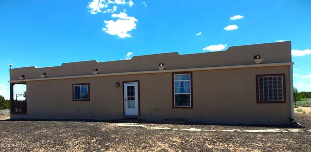 a view of a back yard of the house