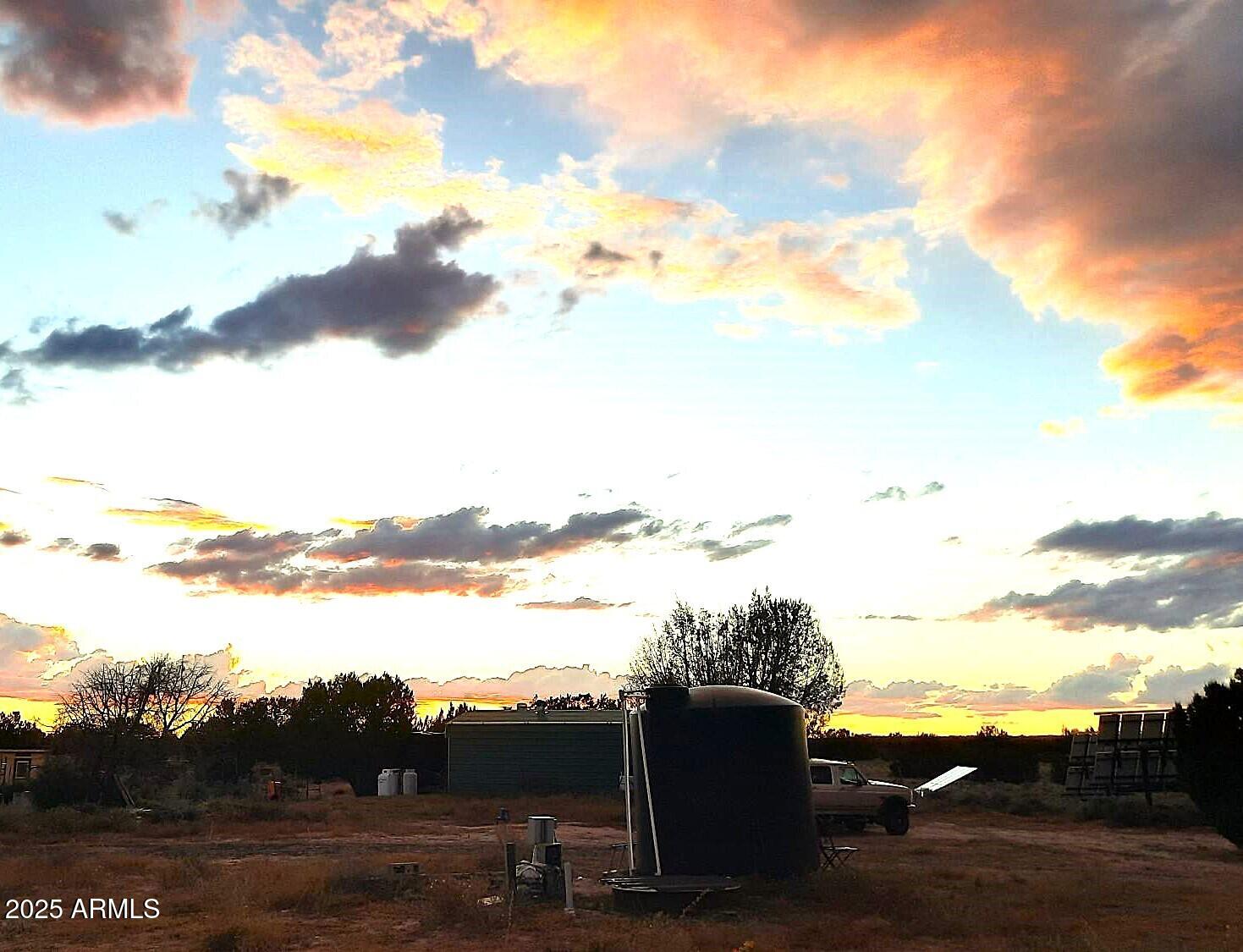 74 N7121 Red Sky Ranch St. Johns, AZ 85936 - Photo 56 of 65 a view of lake with houses in the background