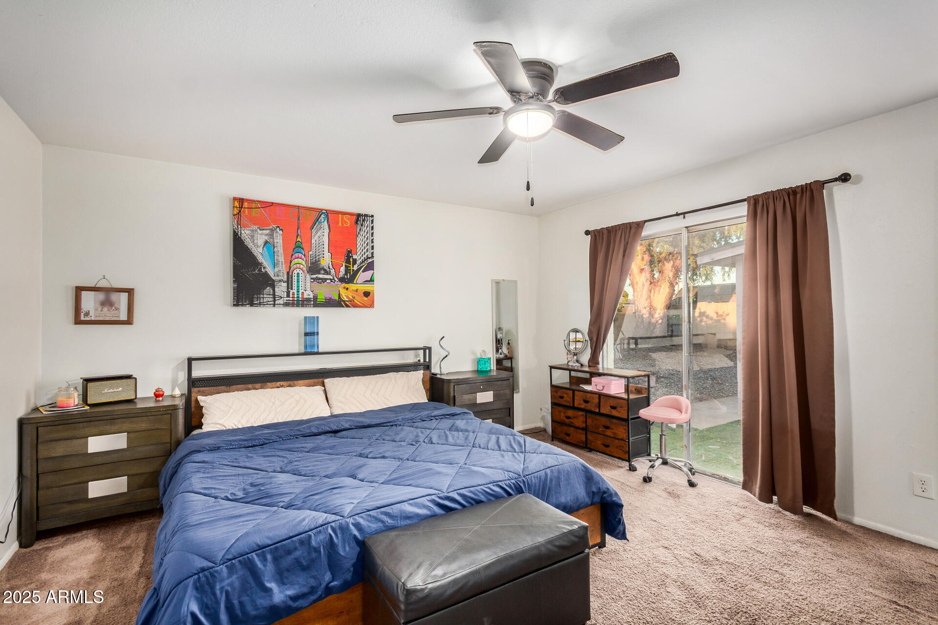 1634 West Villa Rita Drive Phoenix, AZ 85023 - Photo 28 of 47 a bedroom with a bed and a tv on a dresser