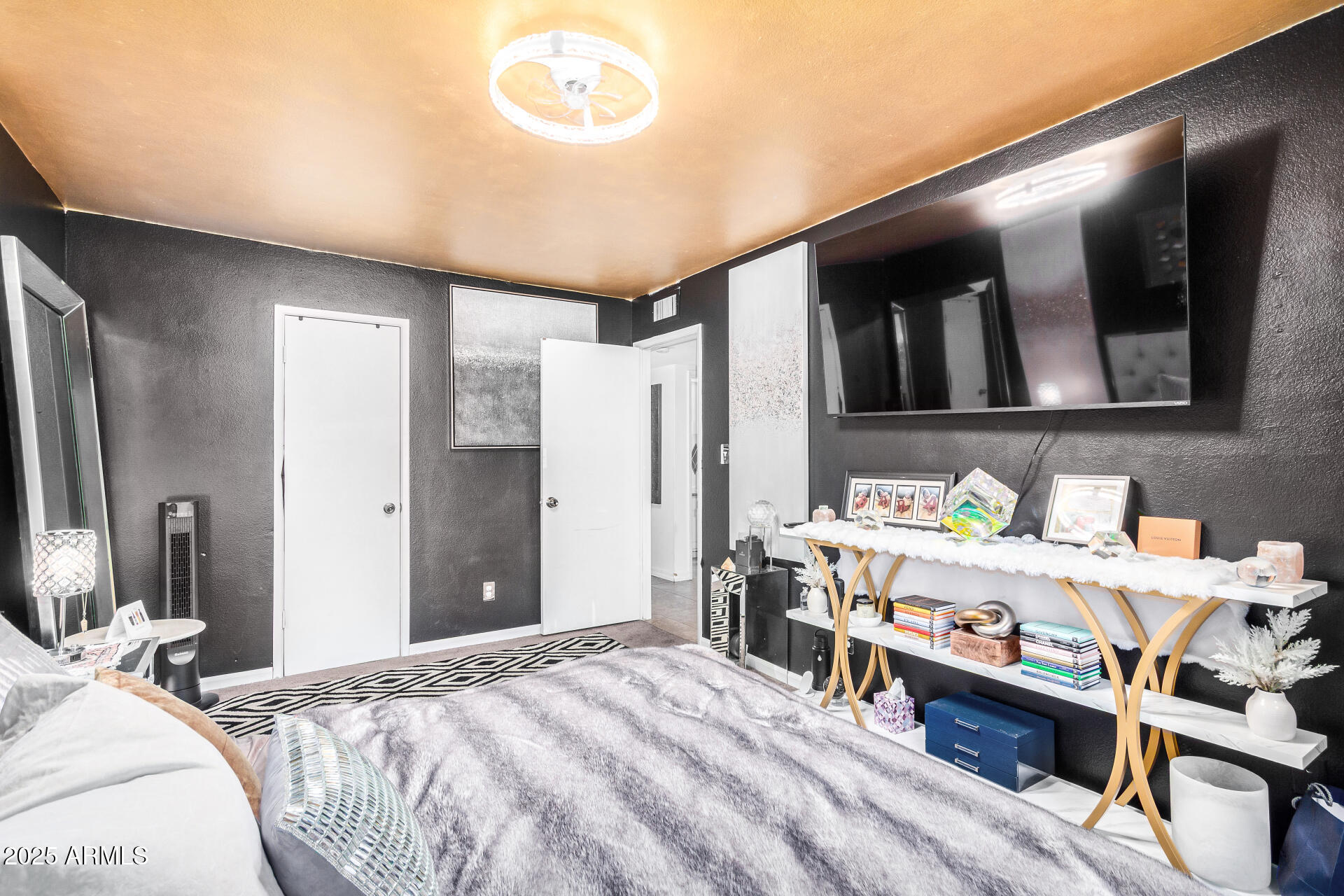 1634 West Villa Rita Drive Phoenix, AZ 85023 - Photo 30 of 47 a bedroom with a bed and a tv in it