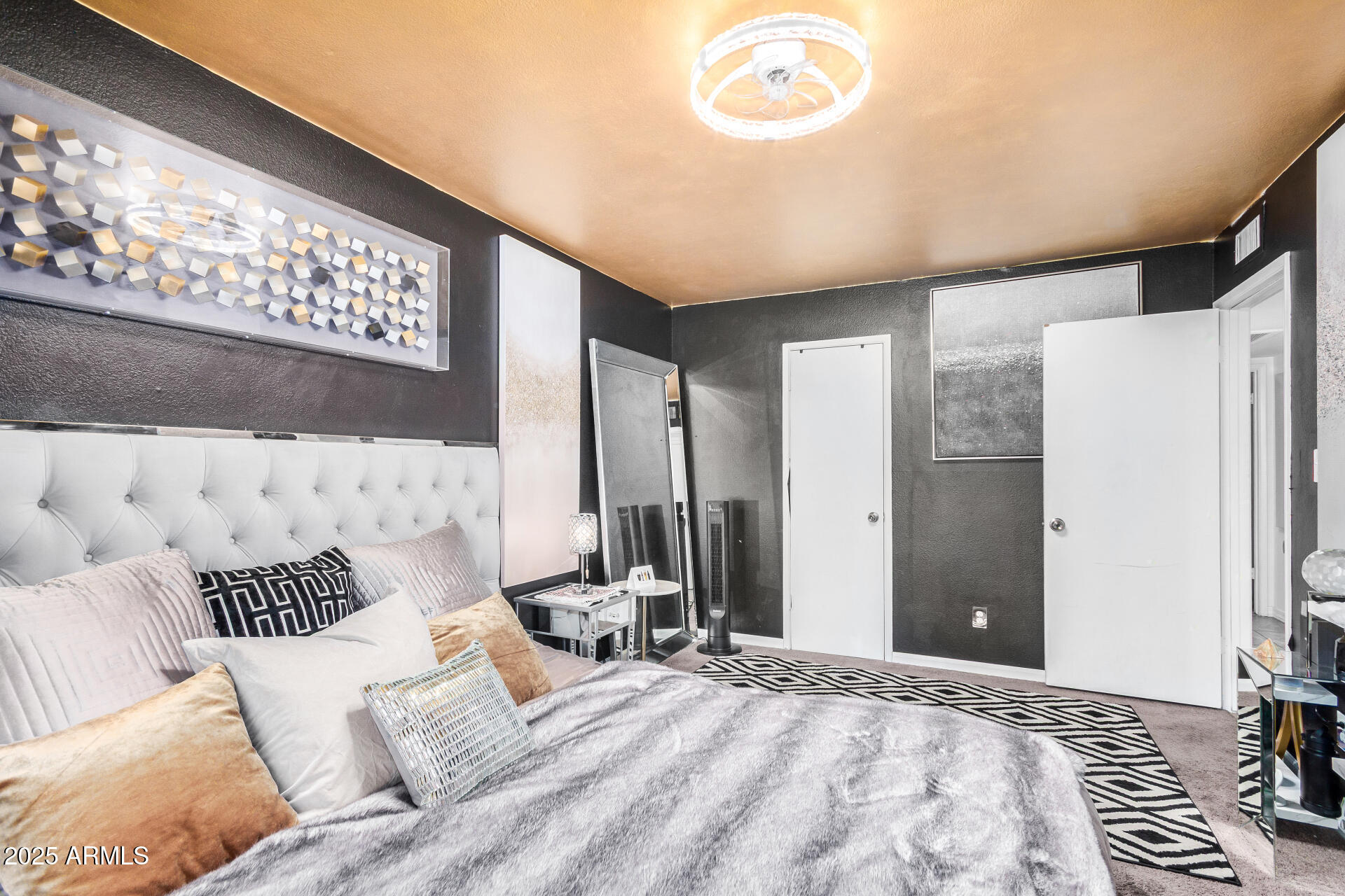 1634 West Villa Rita Drive Phoenix, AZ 85023 - Photo 31 of 47 a bedroom with a large bed and a large mirror