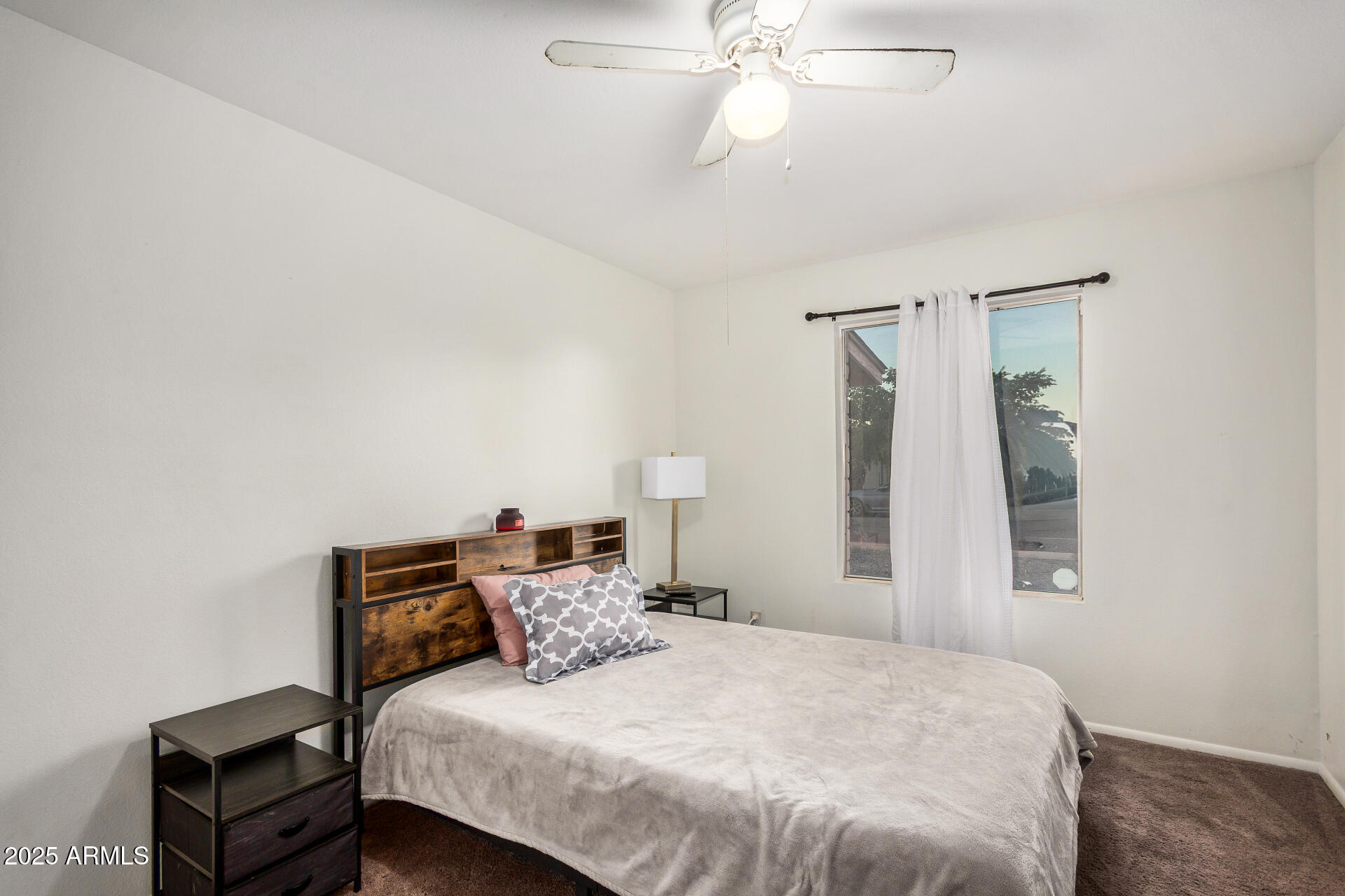 1634 West Villa Rita Drive Phoenix, AZ 85023 - Photo 32 of 47 a bedroom with a bed and a chandelier