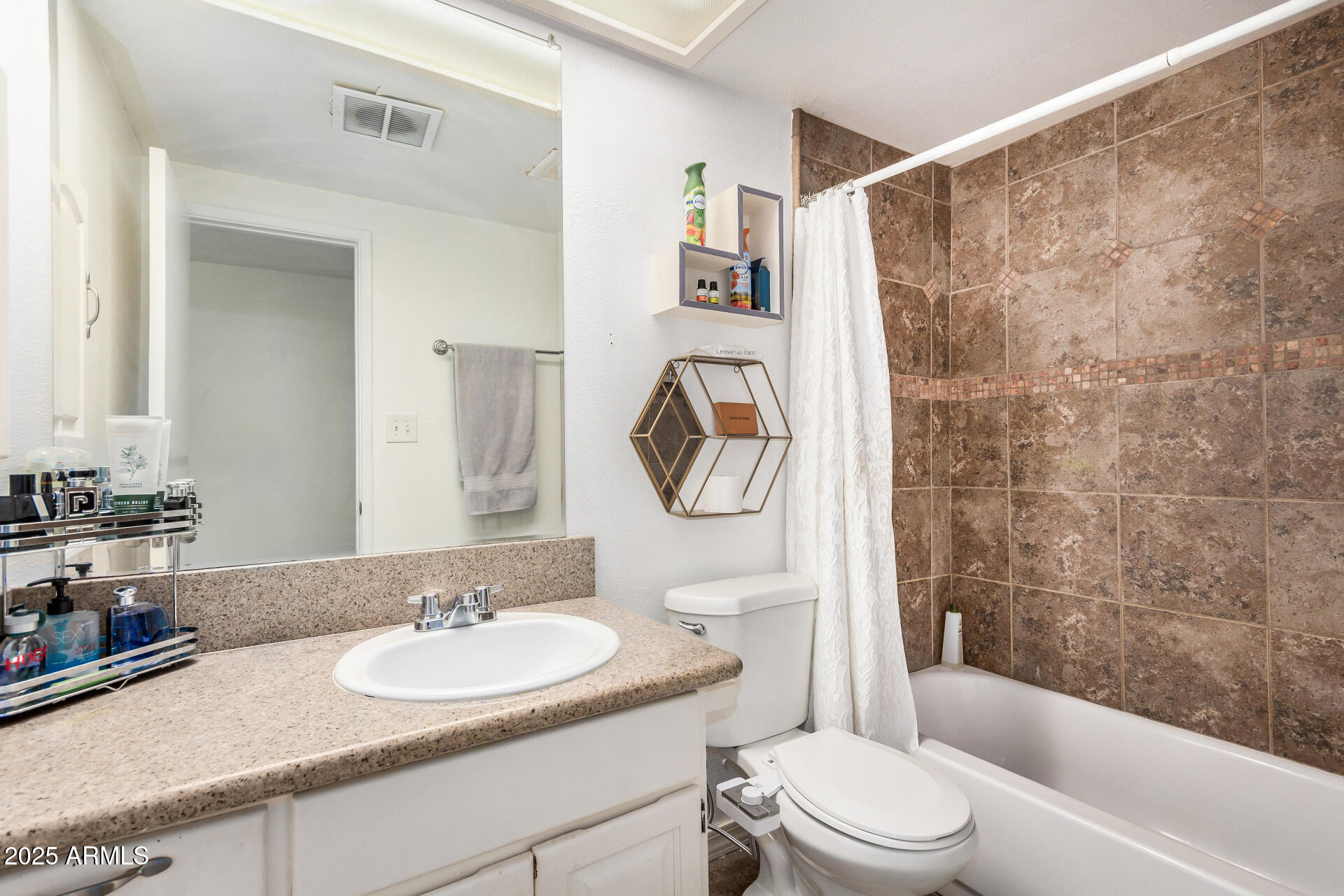 1634 West Villa Rita Drive Phoenix, AZ 85023 - Photo 35 of 47 a bathroom with a granite countertop sink toilet a mirror and shower