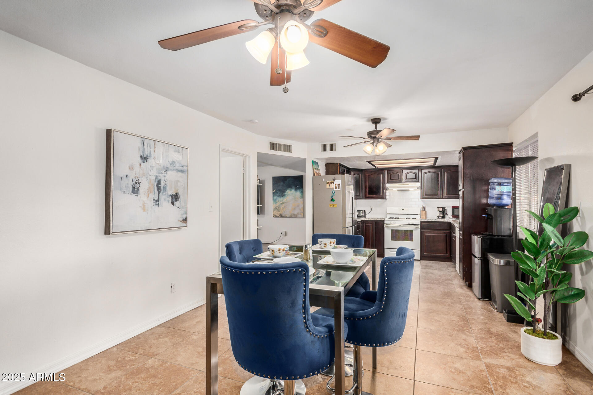 1634 West Villa Rita Drive Phoenix, AZ 85023 - Photo 8 of 47 a dining room with furniture and chandelier
