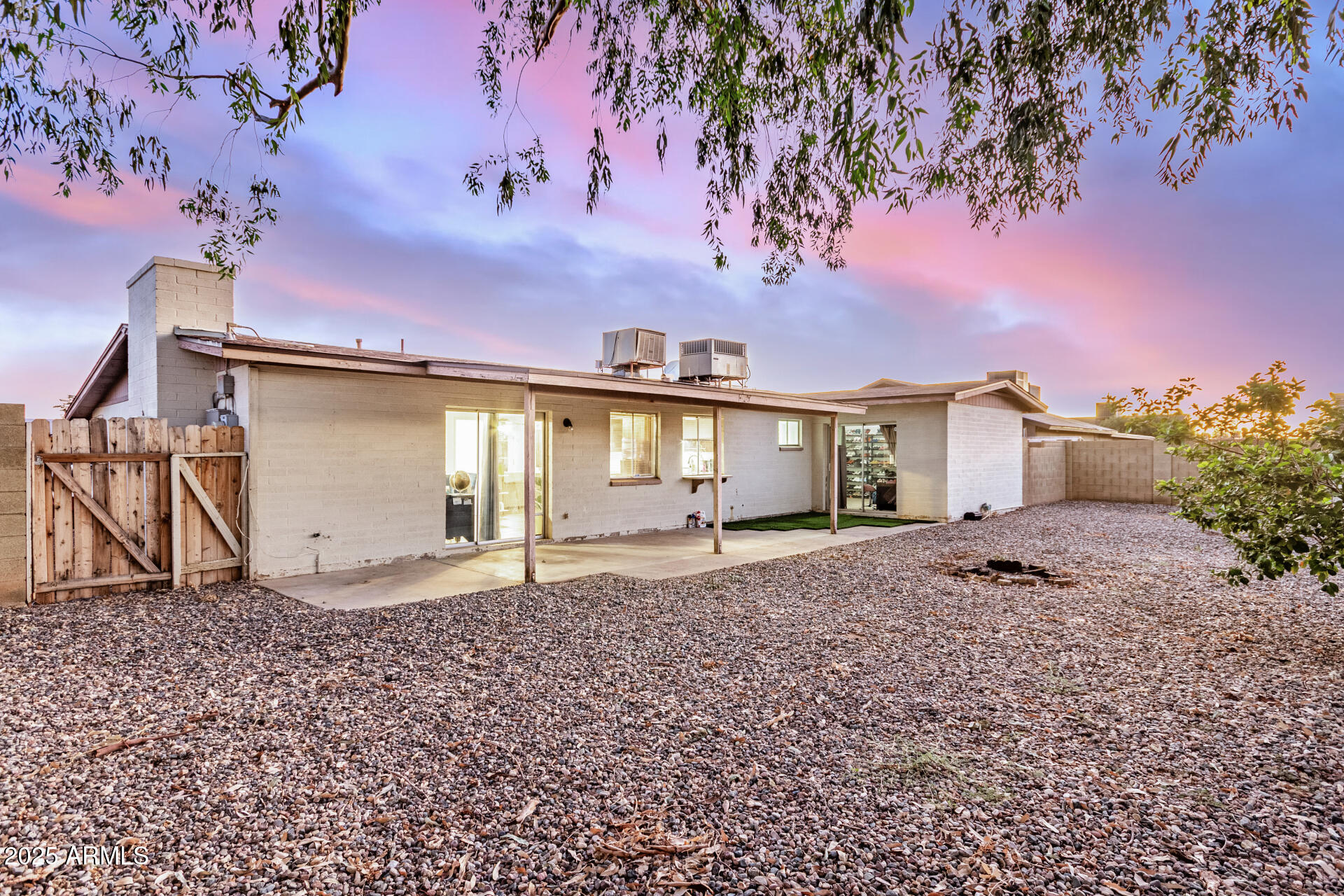1634 West Villa Rita Drive Phoenix, AZ 85023 - Photo 10 of 47 a view of a house with a backyard and a tree