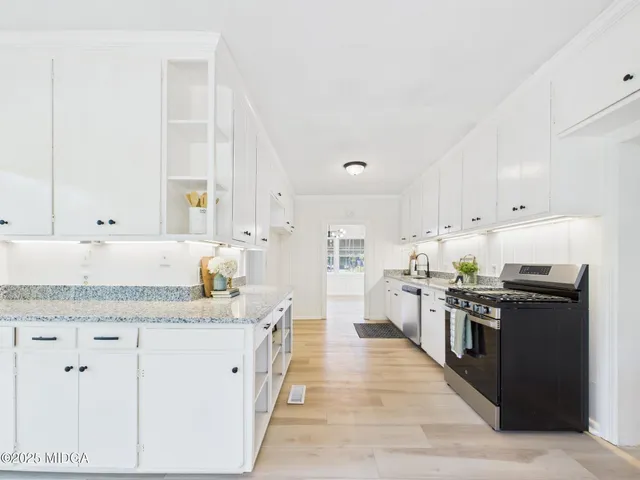 a view of a livingroom with furniture window and wooden floor