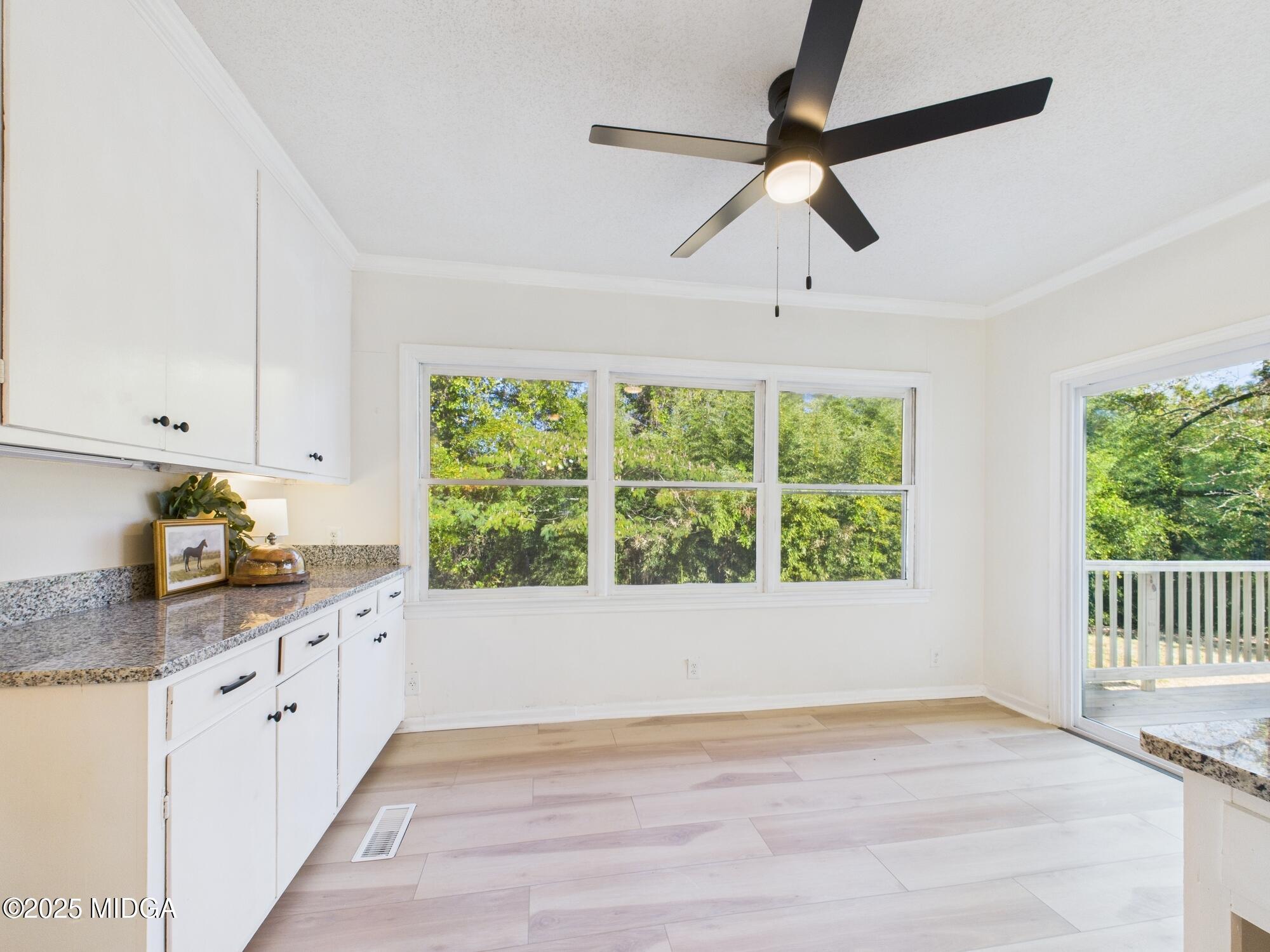621 Forest Hill Road Macon, GA 31210 - Photo 13 of 50 a view of a kitchen with a sink and wooden floor