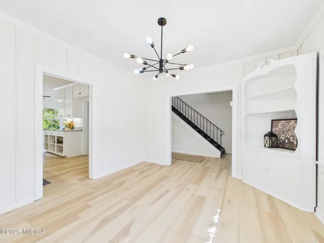 a living room with furniture and next to a window