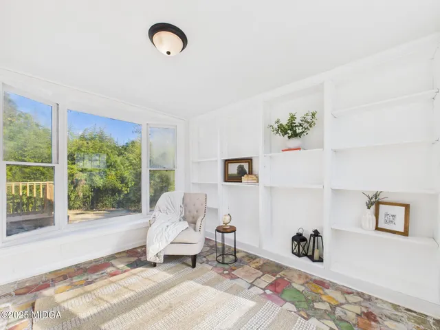 a bed room with a bed and a window