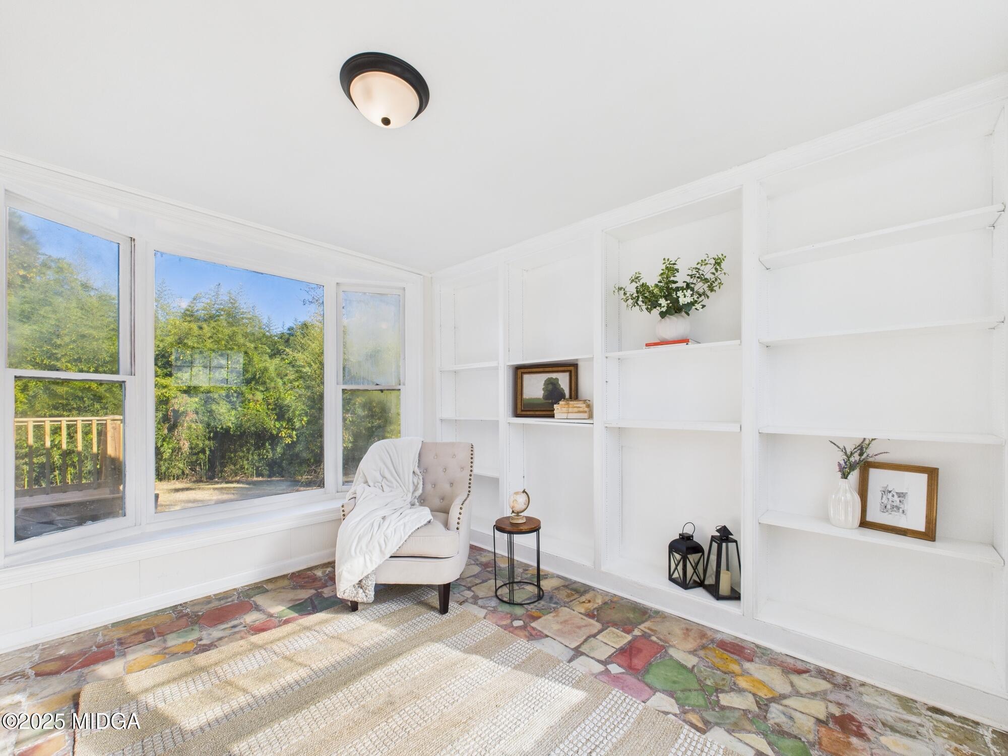 621 Forest Hill Road Macon, GA 31210 - Photo 18 of 50 a living room with furniture and a window
